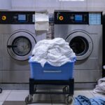a laundry room with a washing machine and a laundry basket